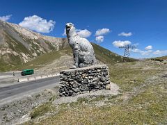 10D The Pamir Highway statue of a snow leopard on the top of Taldyk Pass 3615m on the way to Lenin Peak Base Camp